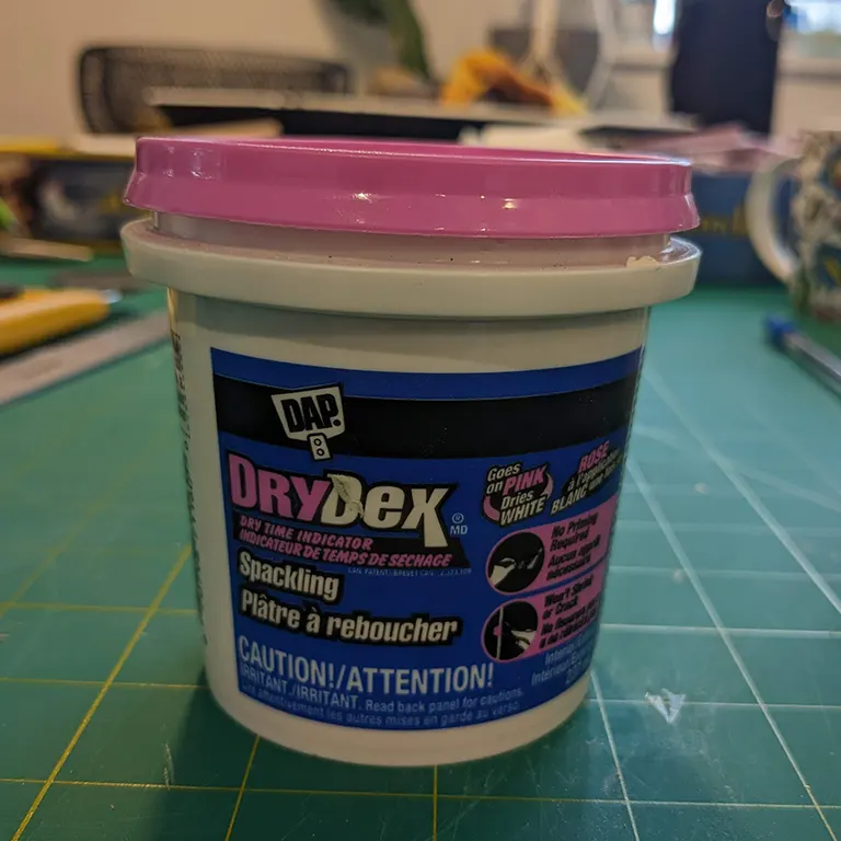 This stuff starts pink but dries white.