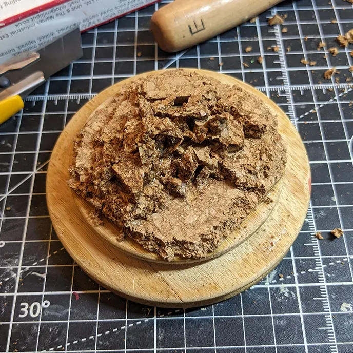 Cork piled up on the plinth.